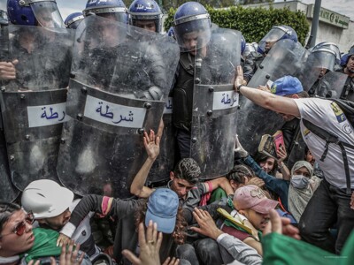 Farouk Batiche, Deutsche Presse-Agentur - Students scuffle with riot police during an anti-government demonstration in Algiers, Algeria.